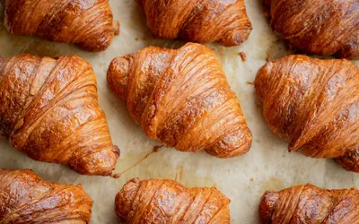 Golden butter croissants on baking paper